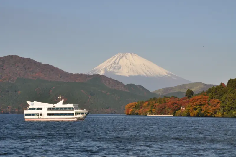 Lake Ashi with Mount Fuji in the background and a red torii gate