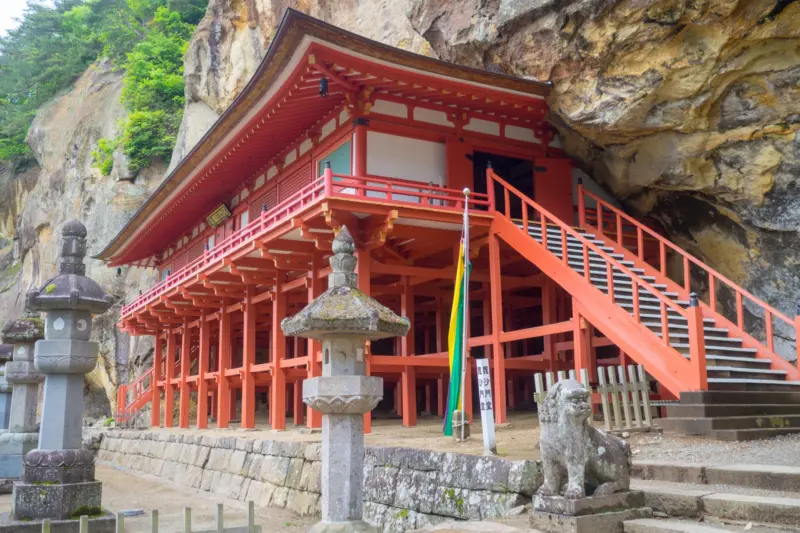 Takkoku no Iwaya, a dramatic temple built into a rock face in Hiraizumi, Japan