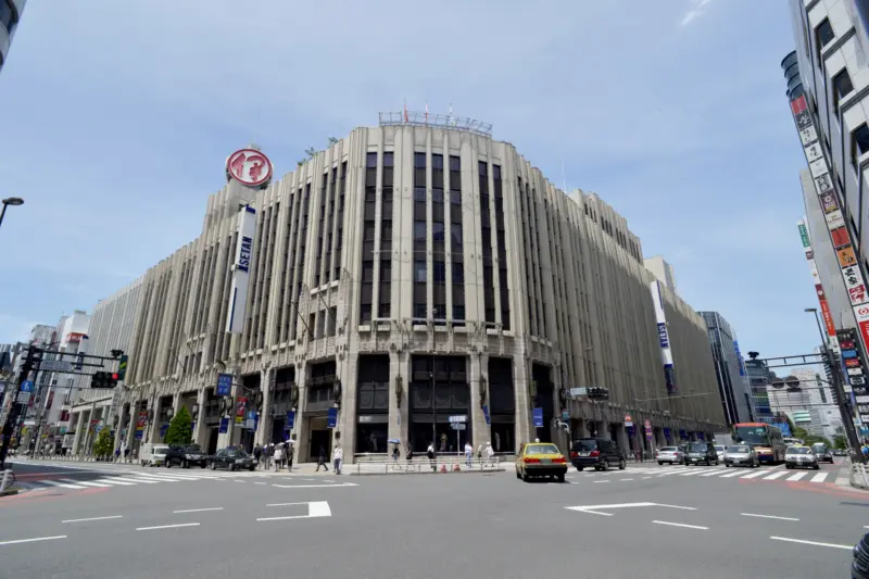 Isetan entrance bustling with shoppers
