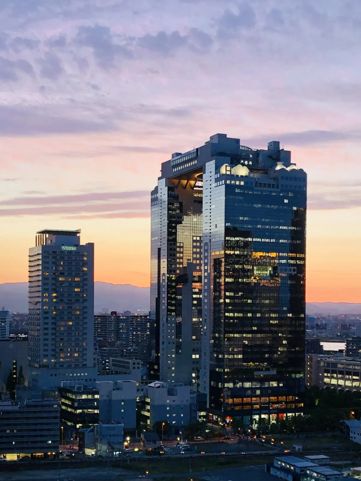 A stunning view of Umeda Sky Building against the Osaka skyline.
