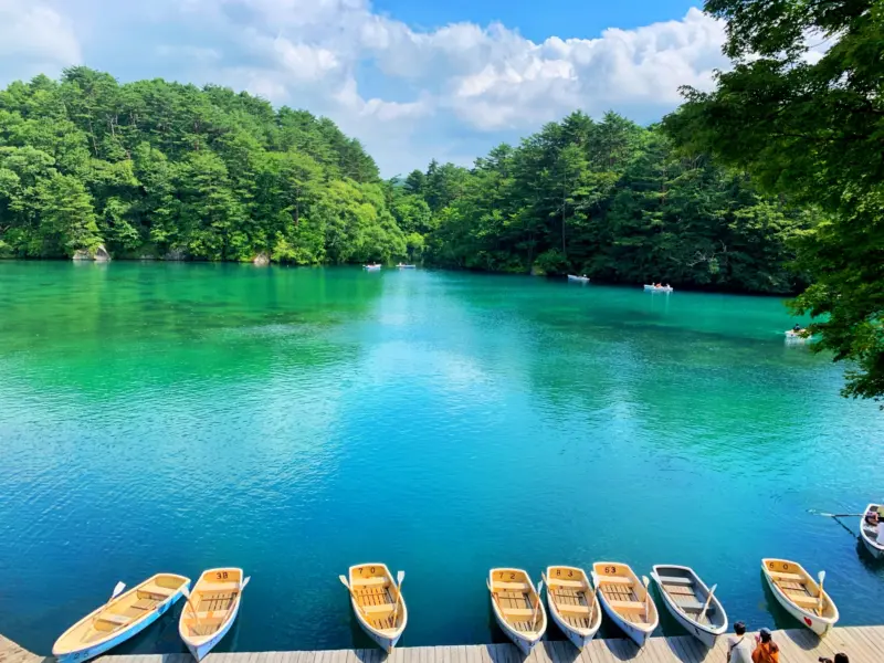 The vibrant turquoise hues of Bishamon Pond in Goshiki-numa