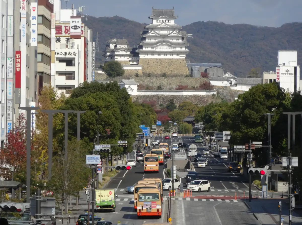 The main keep of Himeji Castle UNESCO World Heritage Site with lush greenery surrounding it.