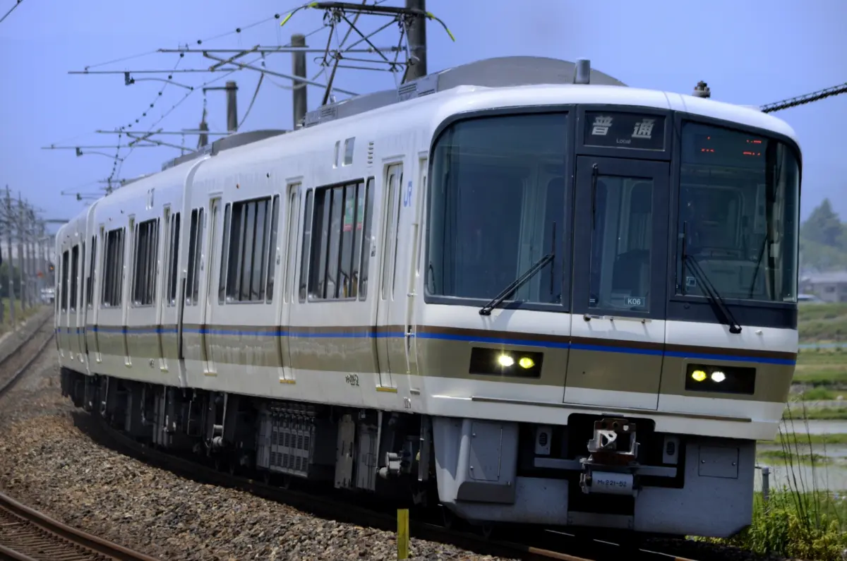 A JR Sagano Line train arriving at Saga-Arashiyama Station in Kyoto.