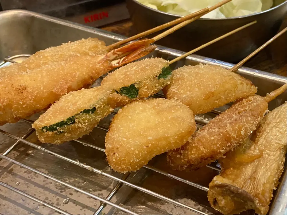 Crispy kushikatsu skewers served with dipping sauce