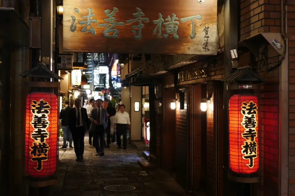 Traditional Japanese-style restaurants and lanterns along Hozenji Yokocho Alley in Dotonbori.