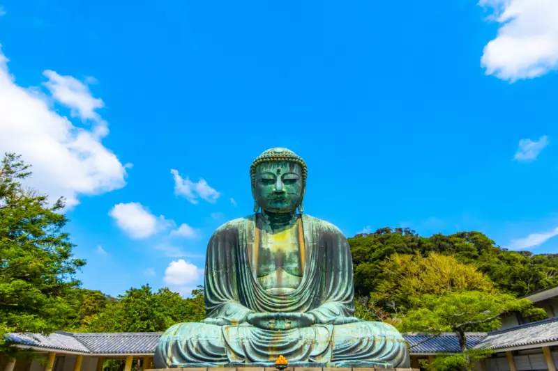 Great Buddha statue in Kamakura with blue skies