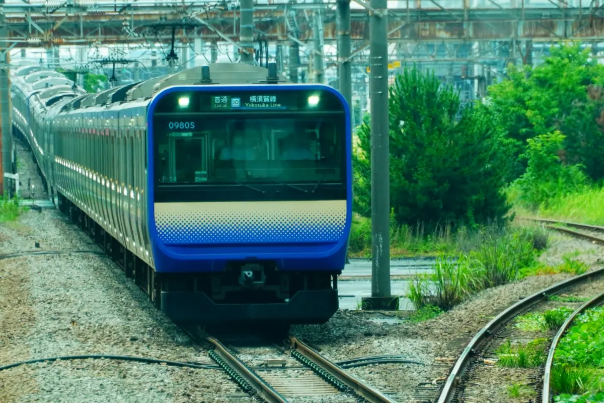 JR Yokosuka Line train waiting at a Tokyo station platform.