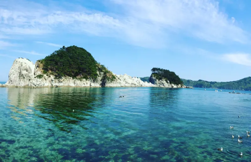 "Dramatic cliffs and blue waters along the Sanriku Coast