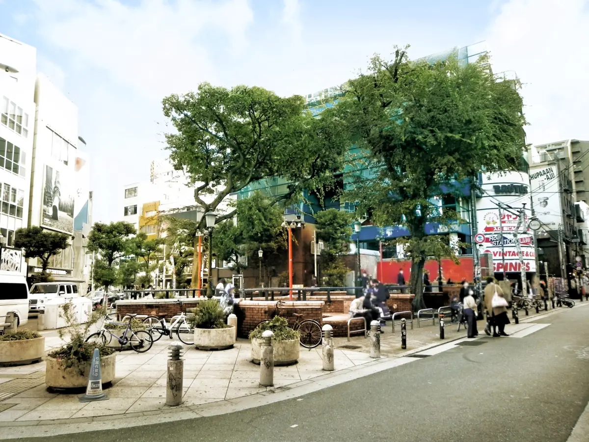 Triangle Park in Amerikamura Osaka, surrounded by trendy shops and street performers.