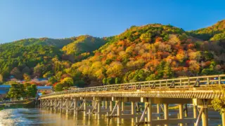 togetukyo Togetsukyo Bridge with a backdrop of vibrant autumn foliage in Arashiyama.