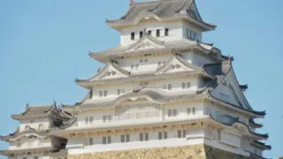 Himeji Castle UNESCO World Heritage Site with its iconic white walls under a clear blue sky