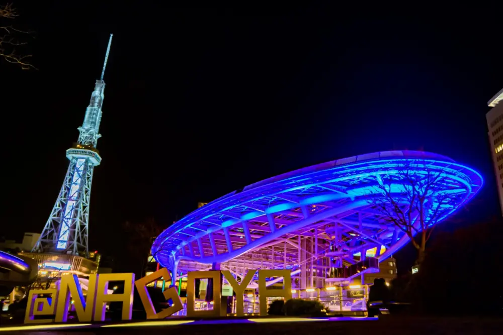 Neon-lit Nagoya TV Tower at night.