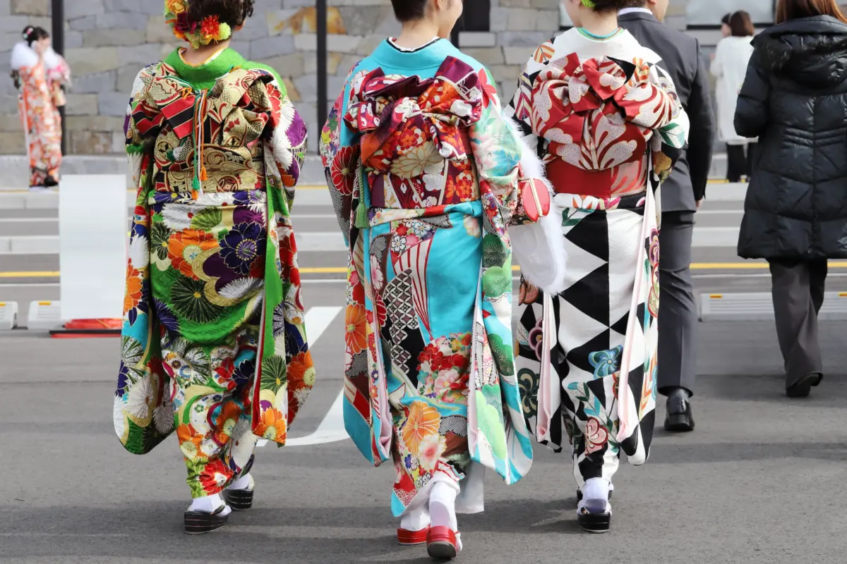 Young women in colorful kimonos attending a Coming of Age ceremony, a key tradition in Japanese holidays and festivals