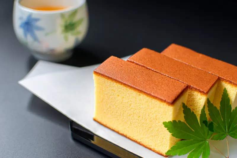 A set of castella and tea served together.