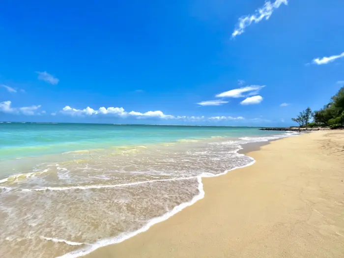 The crystal-clear waters and white sandy beaches of Yonaha Maehama Beach on Miyako Island, Okinawa.