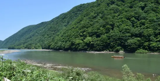 The Mogami River with scenic boat rides, cherry blossoms, and colorful autumn foliage.