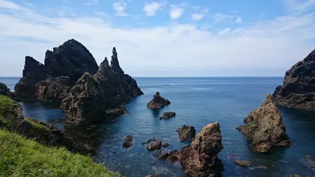 The rugged cliffs and clear blue waters of the Oki Islands, a UNESCO Global Geopark in Shimane