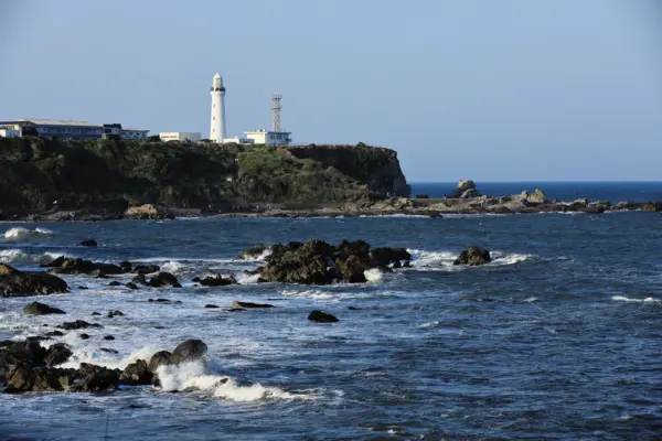 Inubosaki Lighthouse, standing tall against the backdrop of the Pacific Ocean.