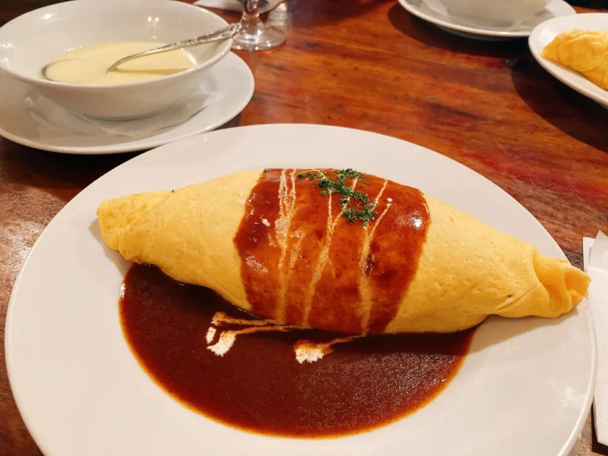 Omurice, a Japanese comfort food made with fried rice wrapped in a fluffy omelet.