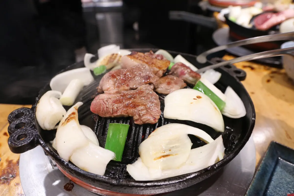 Grilled lamb and vegetables, a regional specialty from Hokkaido known as Genghis Khan.