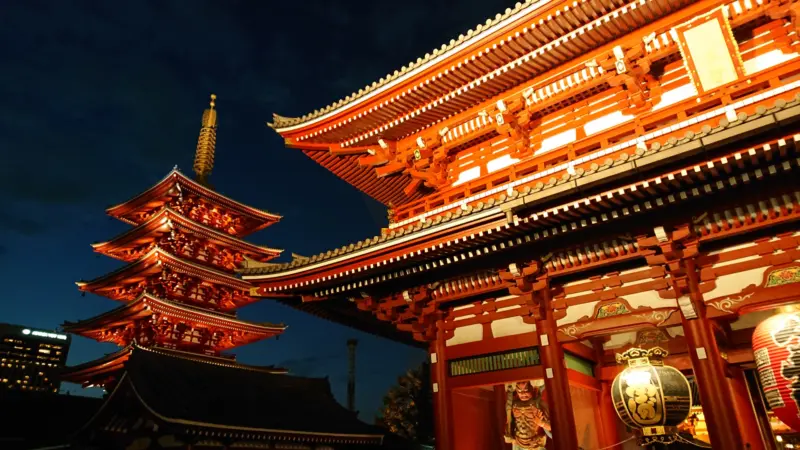 The illuminated Senso-ji Temple at night, a famous landmark in Asakusa, Tokyo"
