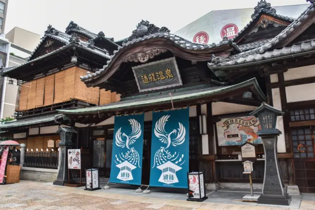 The iconic wooden structure of Dogo Onsen Honkan, one of Japan’s oldest hot springs, in Matsuyama