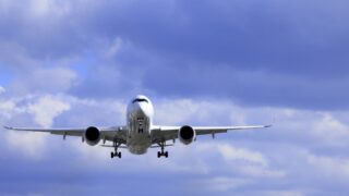 A passenger airplane landing at an airport.