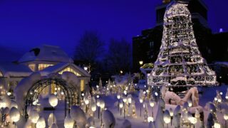 The picturesque entrance to Shiroi Koibito Park in Sapporo, featuring European-style architecture.
