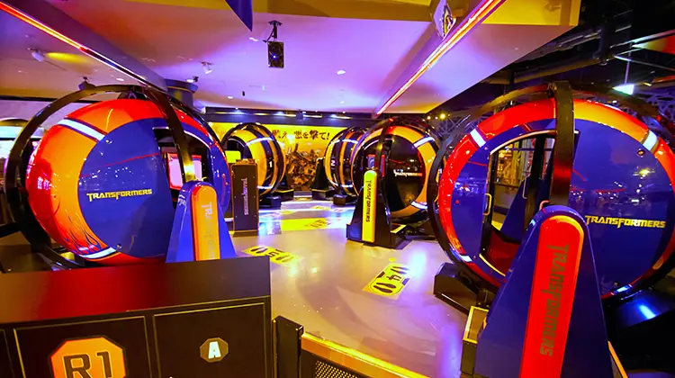 Visitors enjoying a VR ride at Tokyo Joypolis indoor amusement park.