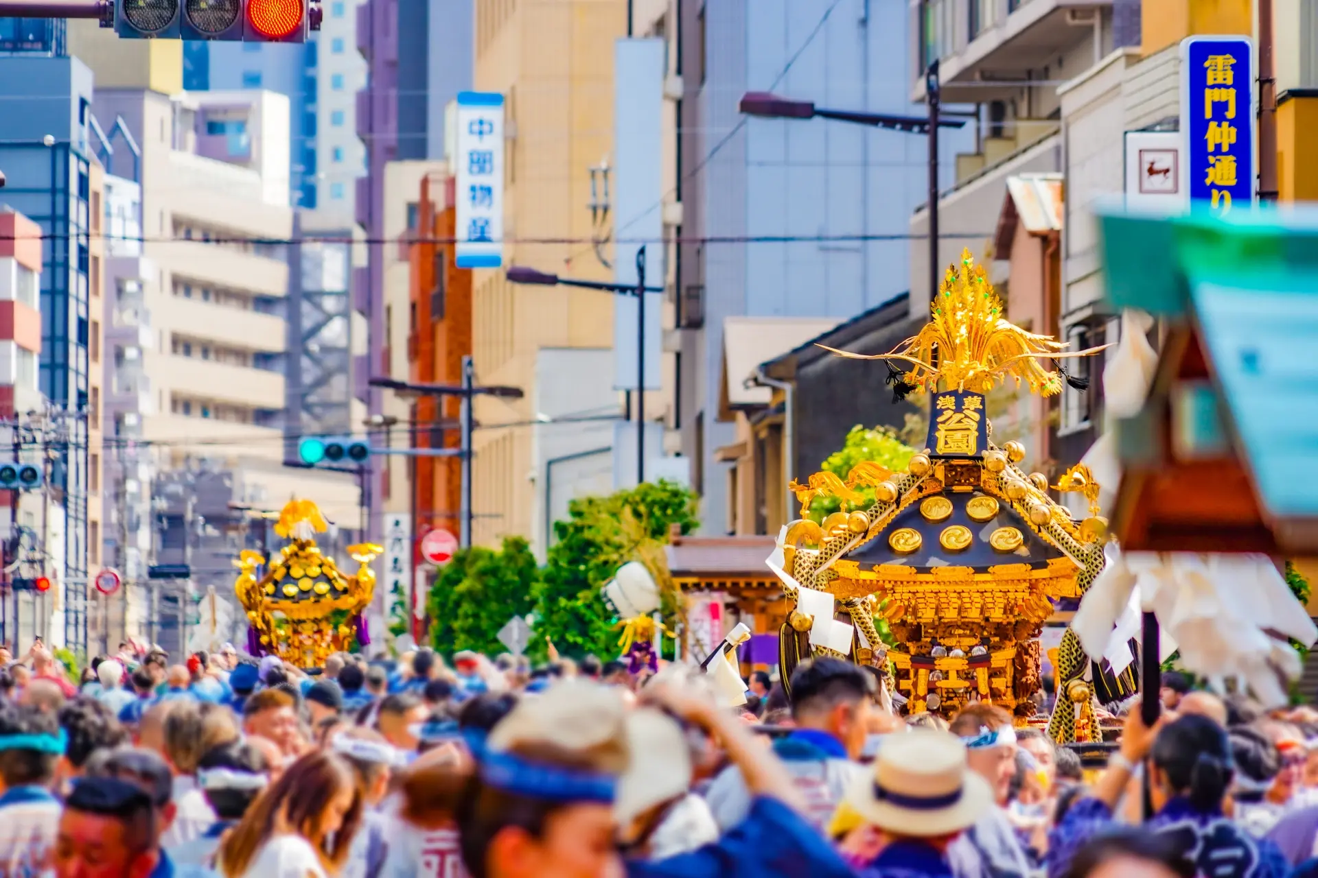 A traditional mikoshi (portable shrine) being carried through the streets during an autumn festival in Japan.