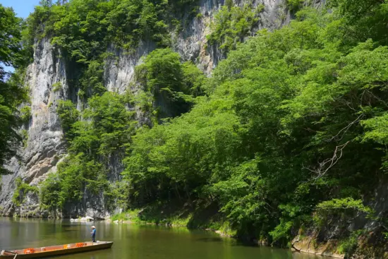 Geibikei Gorge, featuring boat rides through serene waters and towering cliffs.