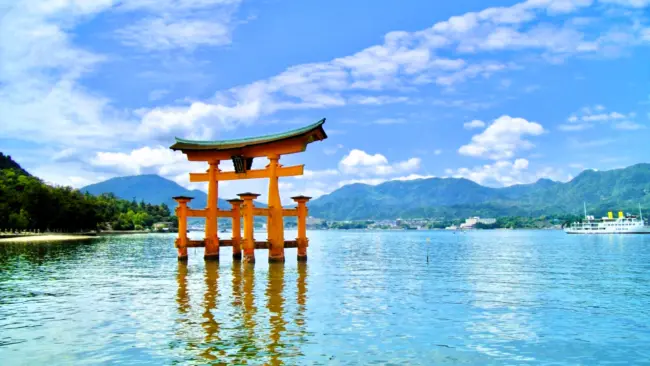 The iconic floating torii gate of Itsukushima Shrine on Miyajima Island at sunset
