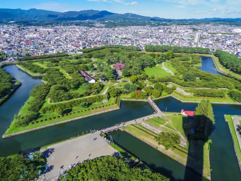  Aerial view of Goryokaku Fort with cherry blossoms in full bloom.