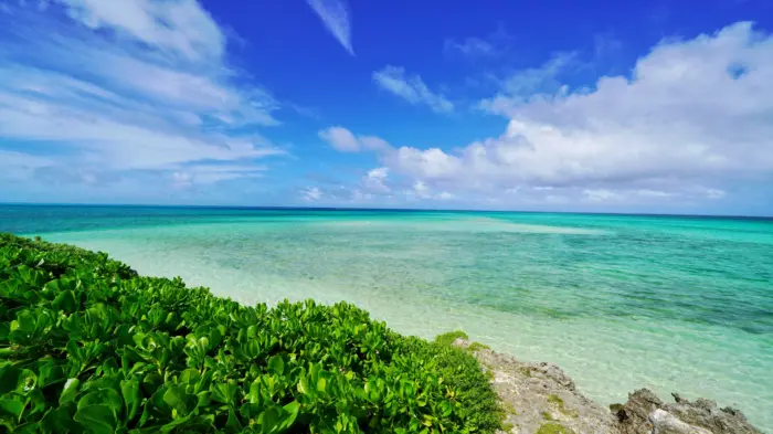 The crystal-clear waters and white sandy beaches of Yonaha Maehama Beach on Miyako Island, Okinawa.