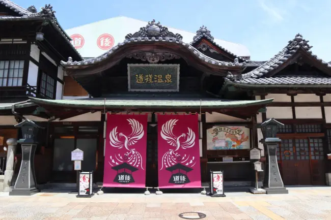 The iconic wooden structure of Dogo Onsen Honkan, one of Japan’s oldest hot springs, in Matsuyama