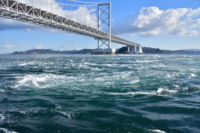 The impressive Naruto Whirlpools in the Naruto Strait, viewed from a sightseeing boat.
