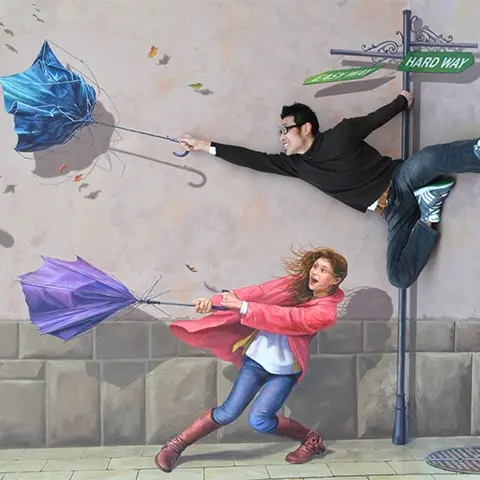 Visitor posing with 3D optical illusions at Tokyo Trick Art Museum.