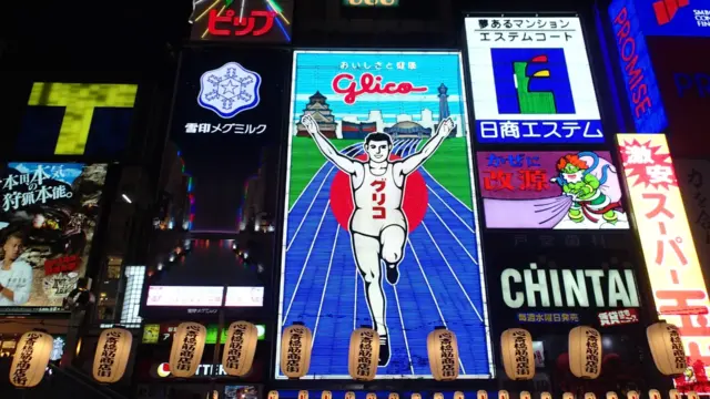Glico sign glowing with neon lights in Dotonbori, Osaka.