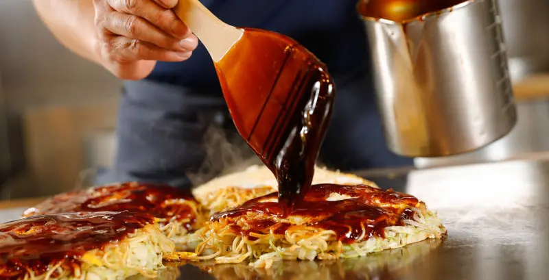 A delicious plate of Hiroshima okonomiyaki from Mitchan Sohonten.