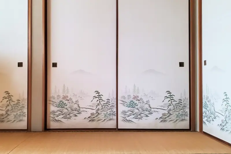 Traditional Japanese fusuma sliding panels decorated with elegant artwork.