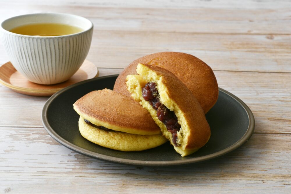 Two fluffy pancakes with a sweet red bean filling, a classic wagashi.